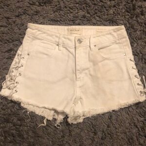 White High Rise PACSUN denim shorts with tied open sides.